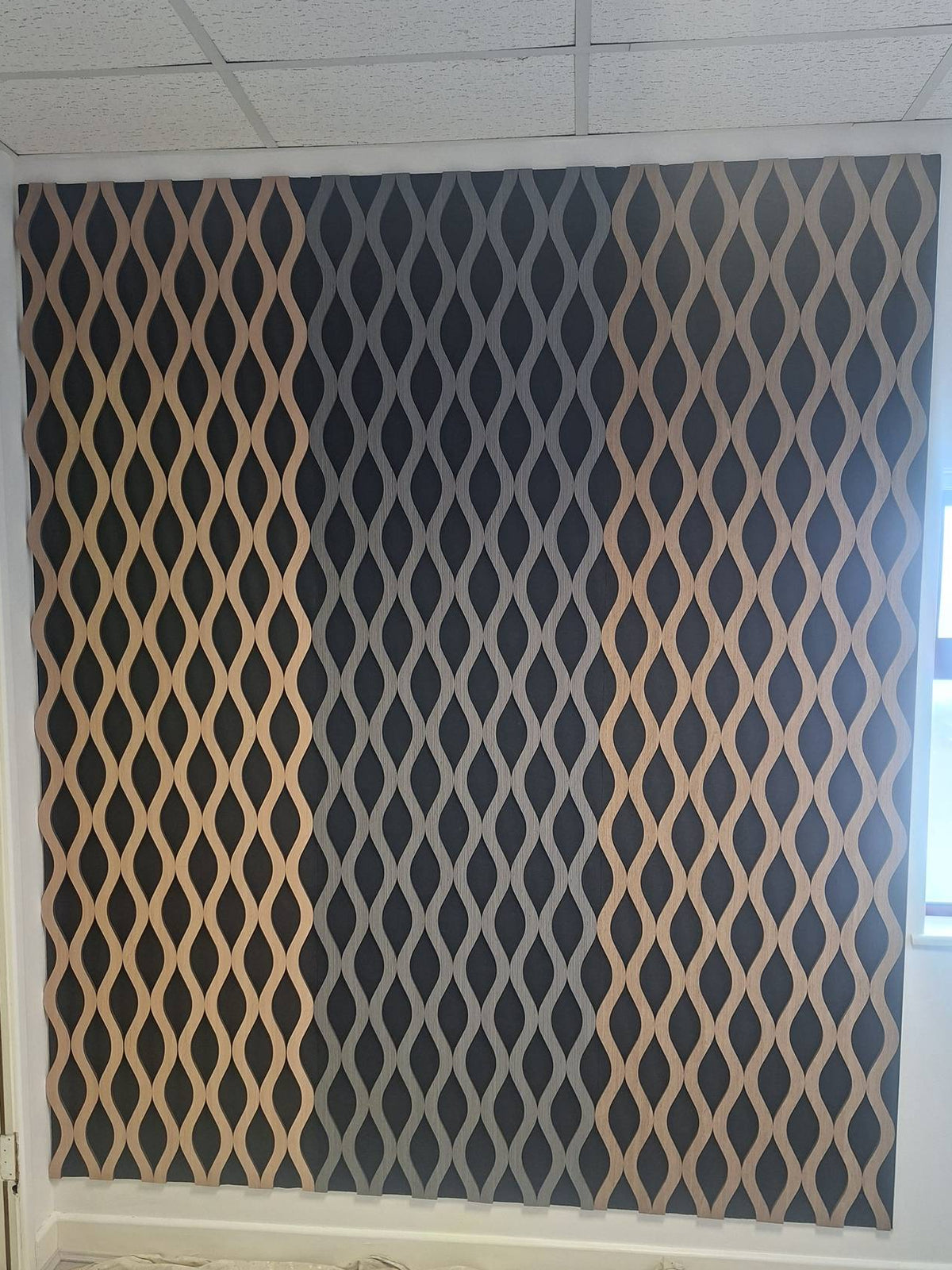 Dark grey wavy acoustic wall panel by The Panel Outlet Ireland, 60x240cm, designed for stylish sound absorption and decor.