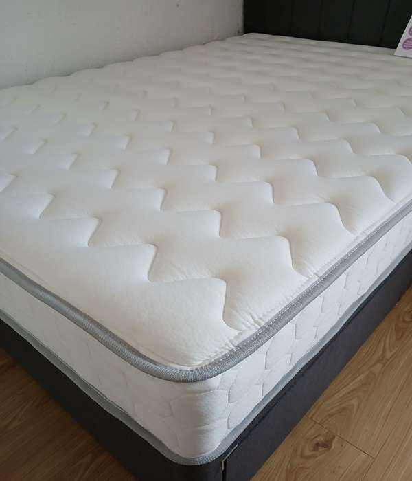 Grey velvet divan bed set with headboard and honey B 2000 pocket sprung mattress, showcasing a stylish and comfortable bedroom setup.