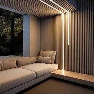 White acoustic wall panel with integrated LED strip lighting, showcasing a natural light wood slatted design by AWS.