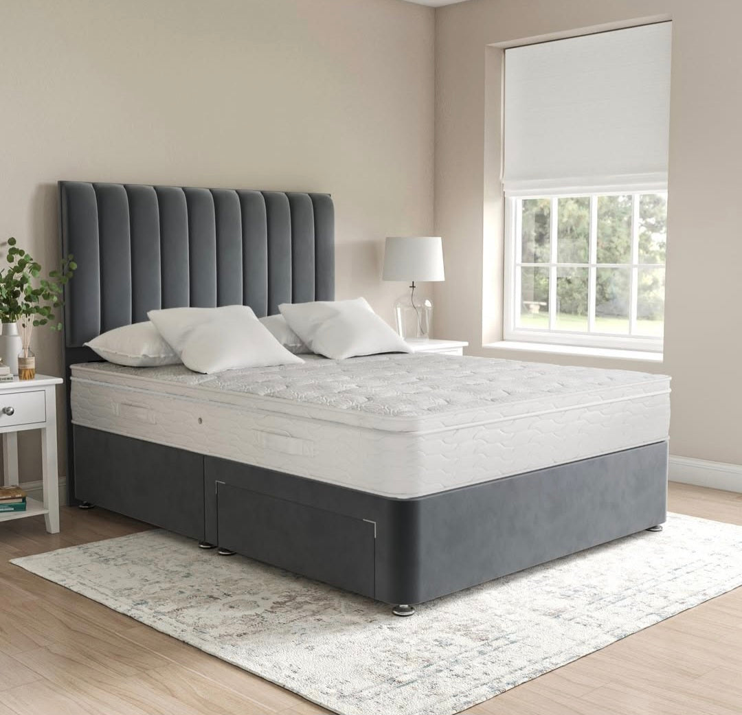 Front view of a grey velvet divan bed set with a headboard and mattress by The Panel Outlet Ireland.