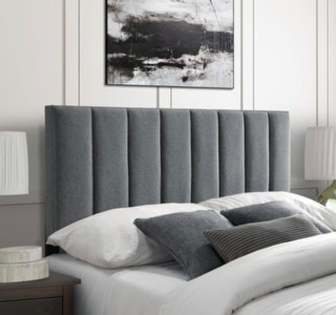 Close-up of grey velvet fluted headboard on a divan bed with mattress, featuring a plush, elegant design from The Panel Outlet Ireland.